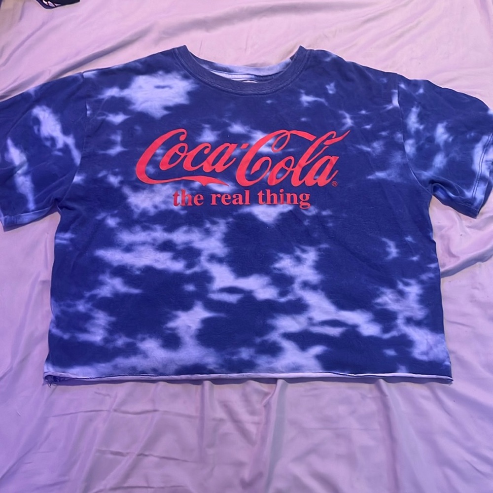 A blue tie dye Coca Cola pajama shirt